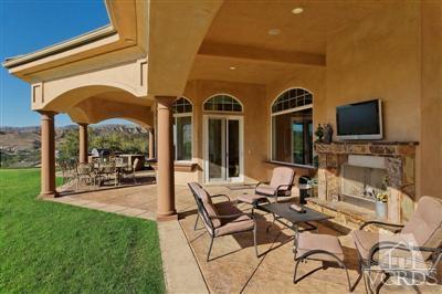 3402 Deep Waters Court Simi Valley, CA 93065 - Photo 29 of 48 a view of a patio with dining table and chairs with a flat tv screen