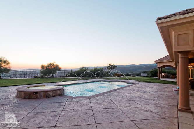 3402 Deep Waters Court Simi Valley, CA 93065 - Photo 40 of 48 a backyard of a house with table and chairs