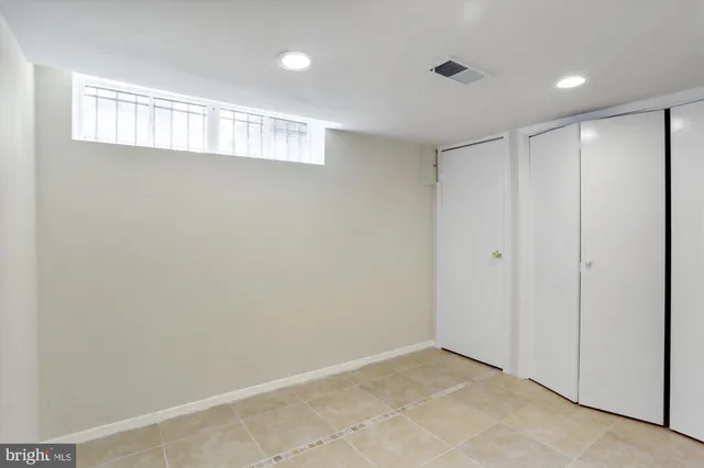 a bathroom with a shower and a sink