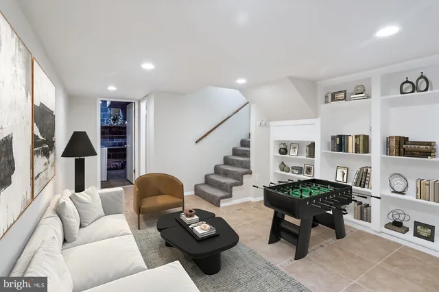 a view of an empty room with a staircase