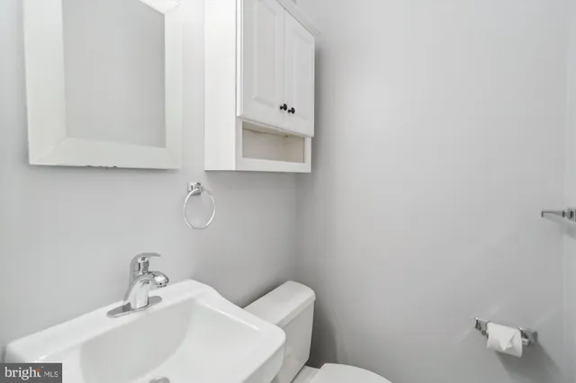 a bathroom with a toilet sink