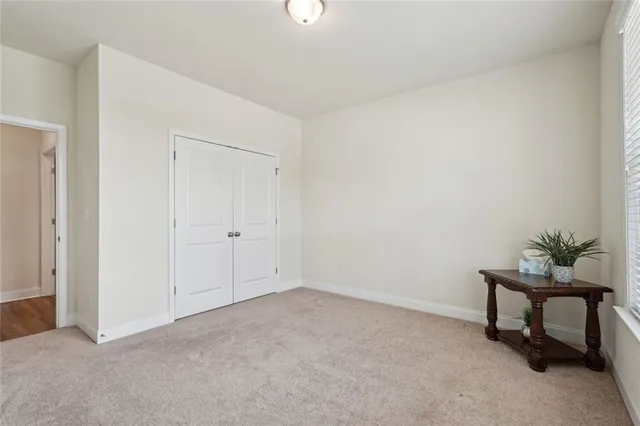 a room with a dresser and a flat screen tv