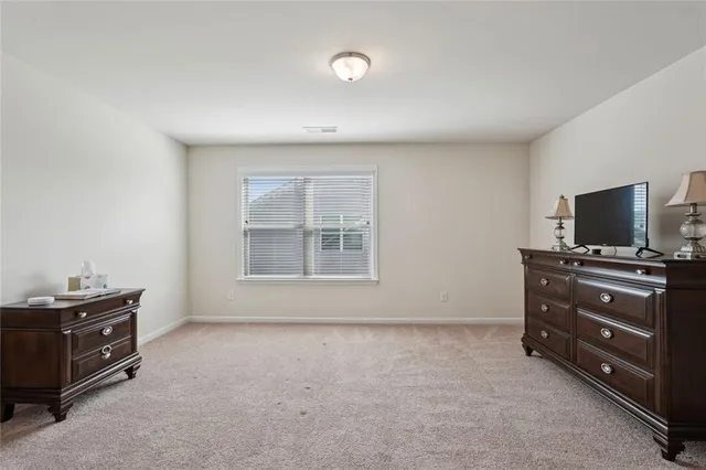 a front view of a house with swimming pool and porch