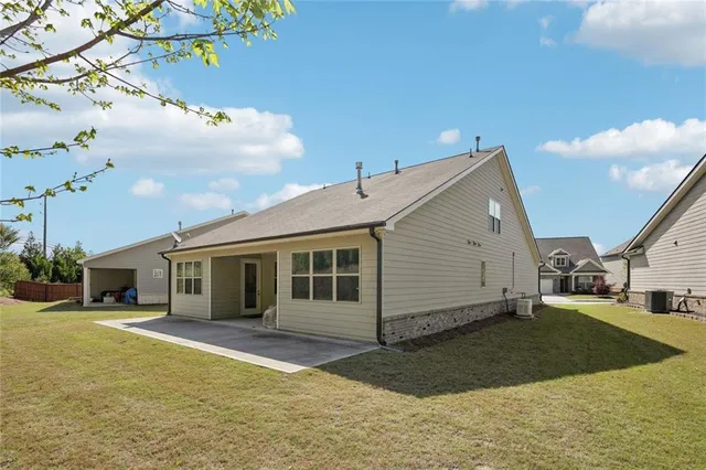 a view of a backyard of the house