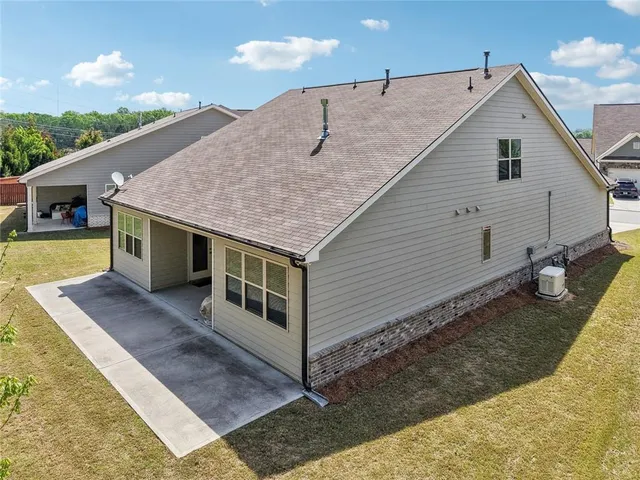 a wooden bench sitting in front of a building