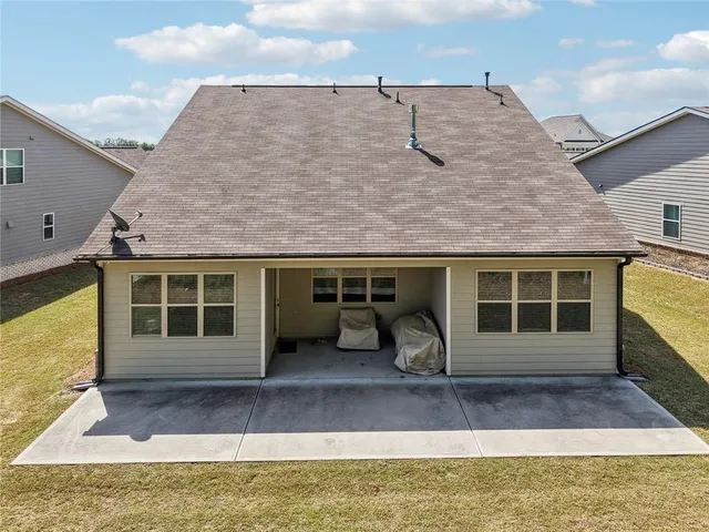 a view of a house with swimming pool and mountains