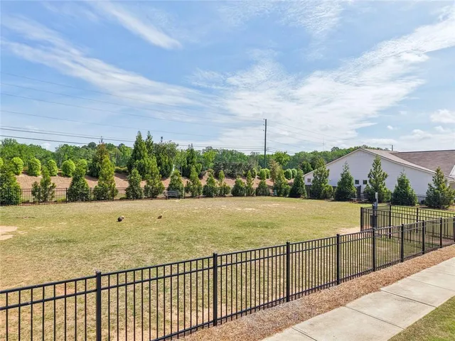 an aerial view of a house with a swimming pool