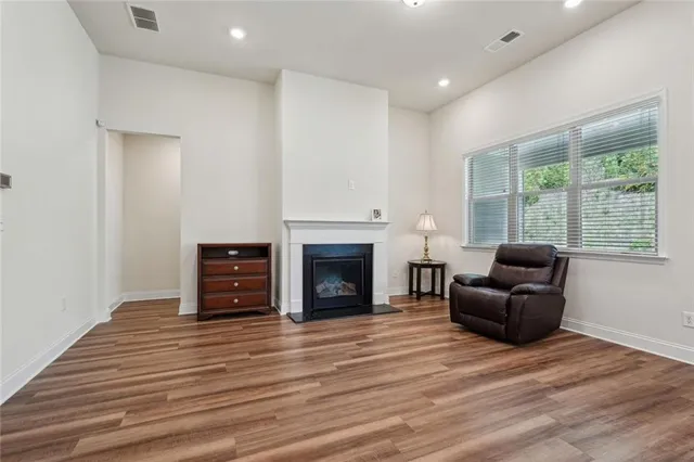 a dining room with furniture and wooden floor