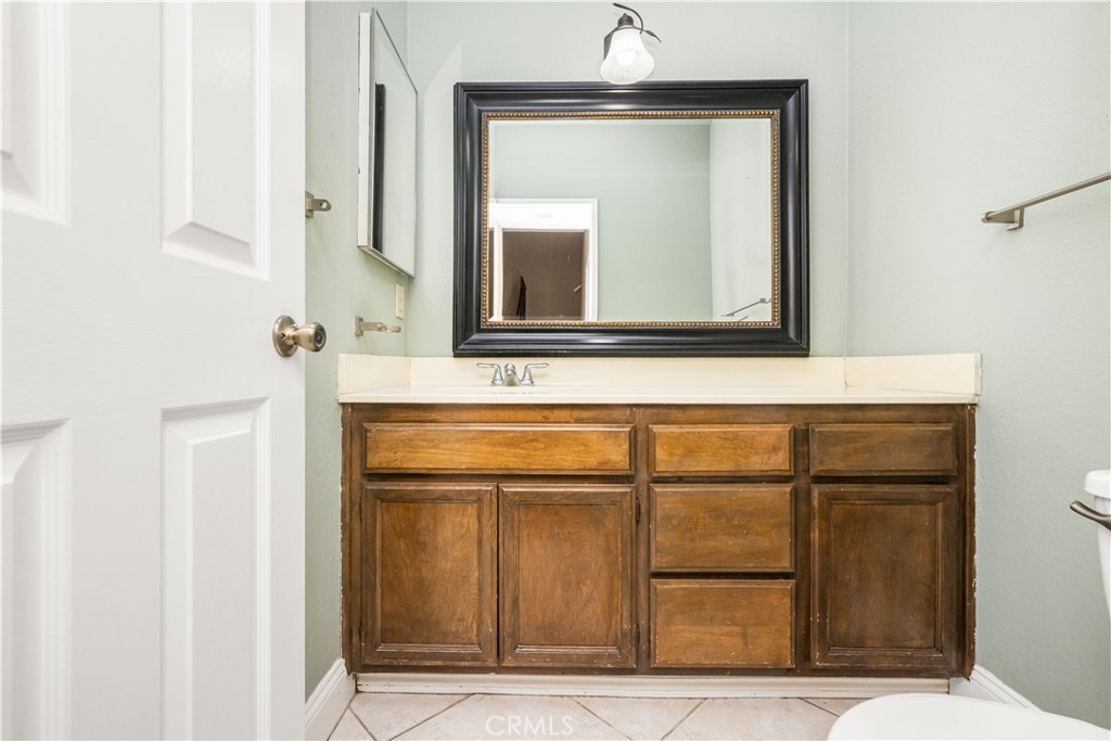 1062 Walnut Street, Unit C Tustin, CA 92780 - Photo 18 of 41 a bathroom with a sink and a mirror