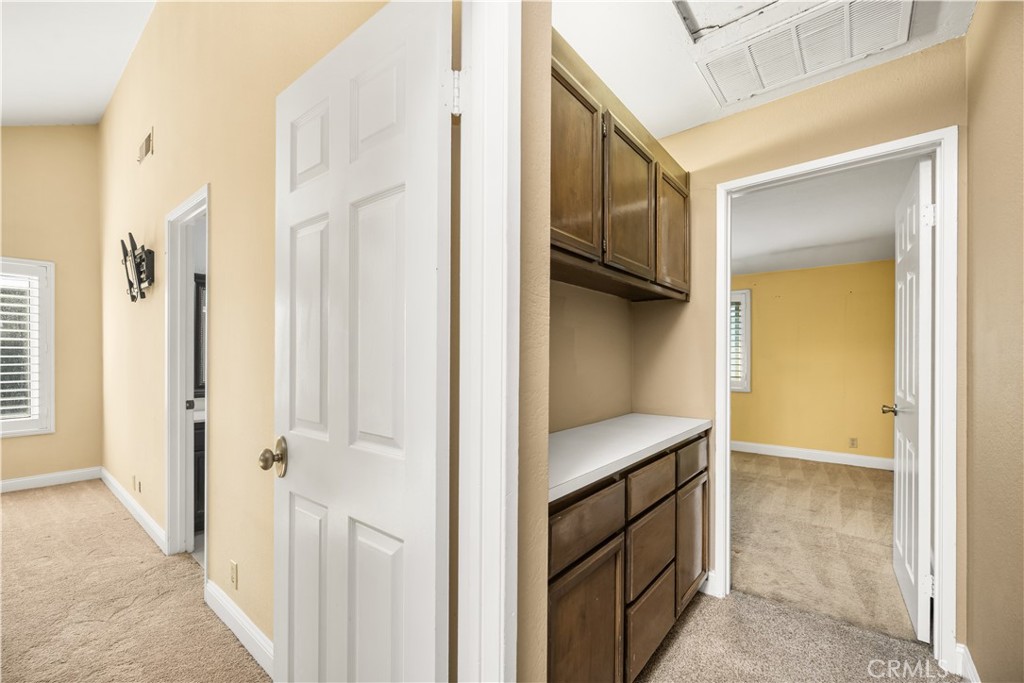 1062 Walnut Street, Unit C Tustin, CA 92780 - Photo 22 of 41 a bathroom with a double vanity sink a toilet and a mirror