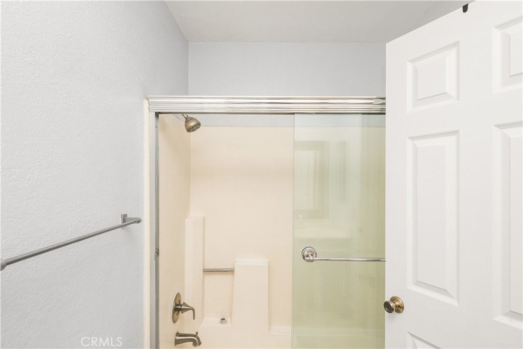 1062 Walnut Street, Unit C Tustin, CA 92780 - Photo 29 of 41 a bathroom with a glass shower door