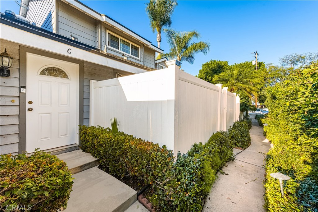 1062 Walnut Street, Unit C Tustin, CA 92780 - Photo 3 of 41 a view of a house with potted plants