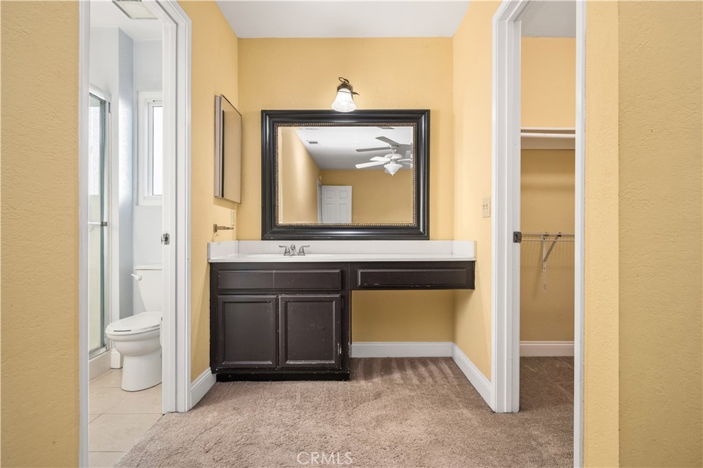 1062 Walnut Street, Unit C Tustin, CA 92780 - Photo 32 of 41 a bathroom with a toilet sink and mirror