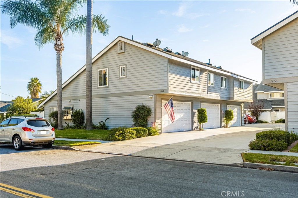 1062 Walnut Street, Unit C Tustin, CA 92780 - Photo 37 of 41 a front view of a house with a garden