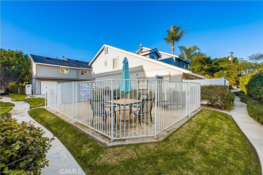 1062 Walnut Street, Unit C Tustin, CA 92780 - Photo 40 of 41 a view of a house with a swimming pool