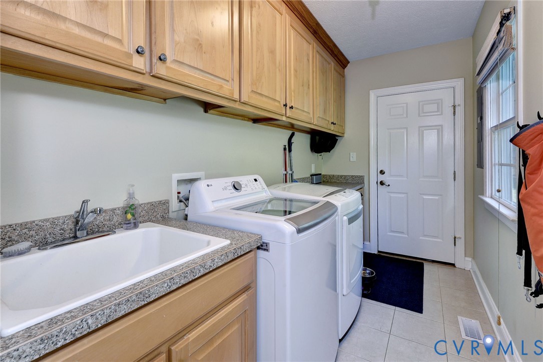 4015 Cold Spring Road Williamsburg, VA 23188 - Photo 22 of 57 Dedicated utility room featuring light wood cabine