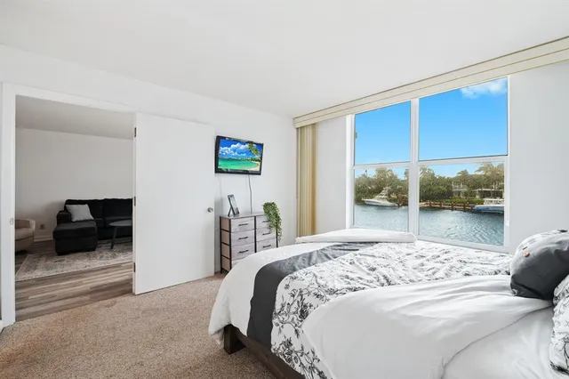 a bedroom with a bed and a couch