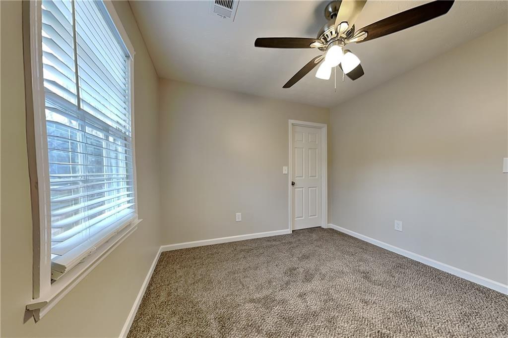 3115 Pond Ridge Trail Snellville, GA 30078 - Photo 12 of 19 a view of room with window and ceiling fan