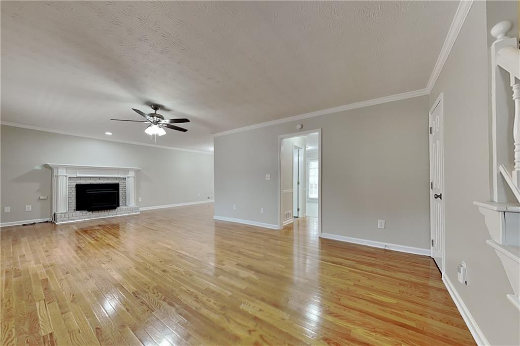 3115 Pond Ridge Trail Snellville, GA 30078 - Photo 2 of 19 a view of an empty room with wooden floor
