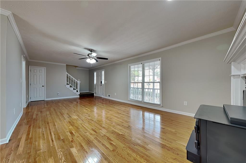 3115 Pond Ridge Trail Snellville, GA 30078 - Photo 3 of 19 a view of empty room with wooden floor and fan