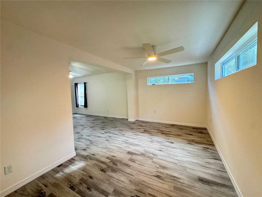3350 Lake Tiny Circle Orlando, FL 32818 - Photo 11 of 27 a view of an empty room and window