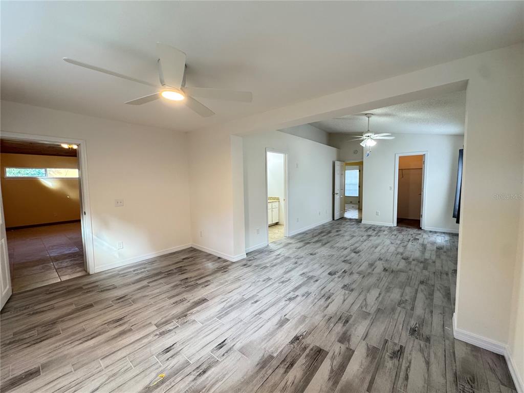 3350 Lake Tiny Circle Orlando, FL 32818 - Photo 12 of 27 a view of an empty room and wooden floor