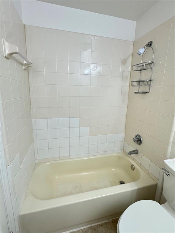 3350 Lake Tiny Circle Orlando, FL 32818 - Photo 14 of 27 a bathroom with a bathtub and toilet