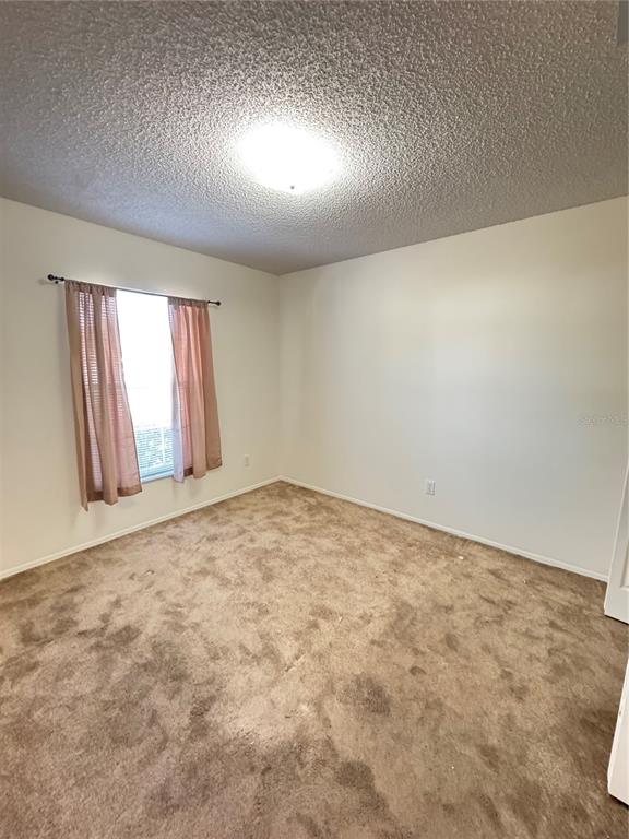 3350 Lake Tiny Circle Orlando, FL 32818 - Photo 18 of 27 an empty room with windows
