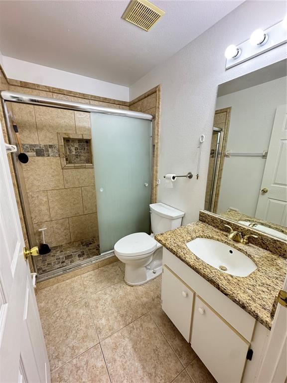 3350 Lake Tiny Circle Orlando, FL 32818 - Photo 22 of 27 a bathroom with a granite countertop sink toilet and shower