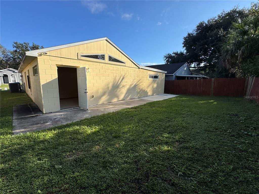 3350 Lake Tiny Circle Orlando, FL 32818 - Photo 25 of 27 a view of a house with a yard