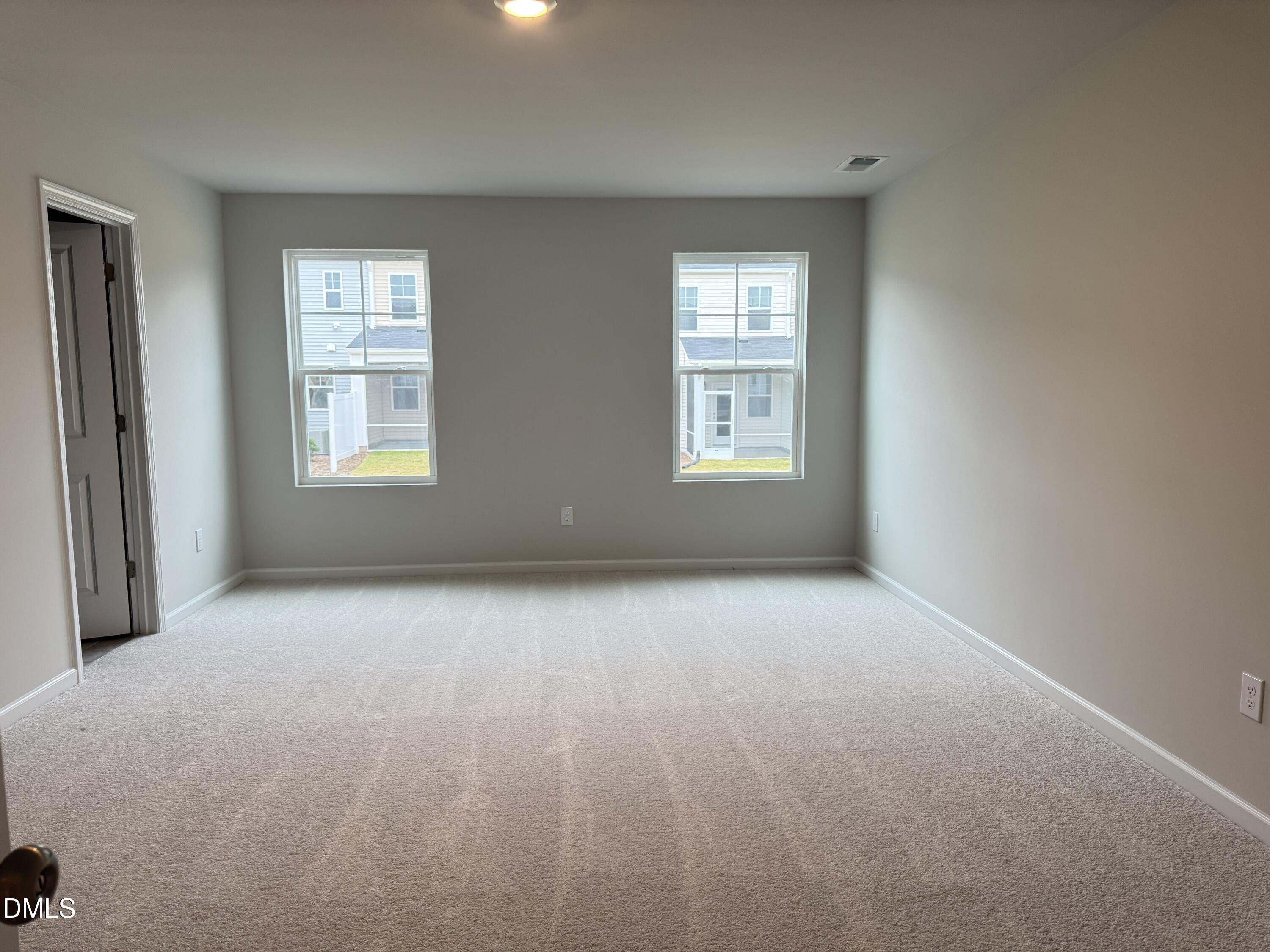 523 Hester Road Durham, NC 27703 - Photo 11 of 21 an empty room with windows