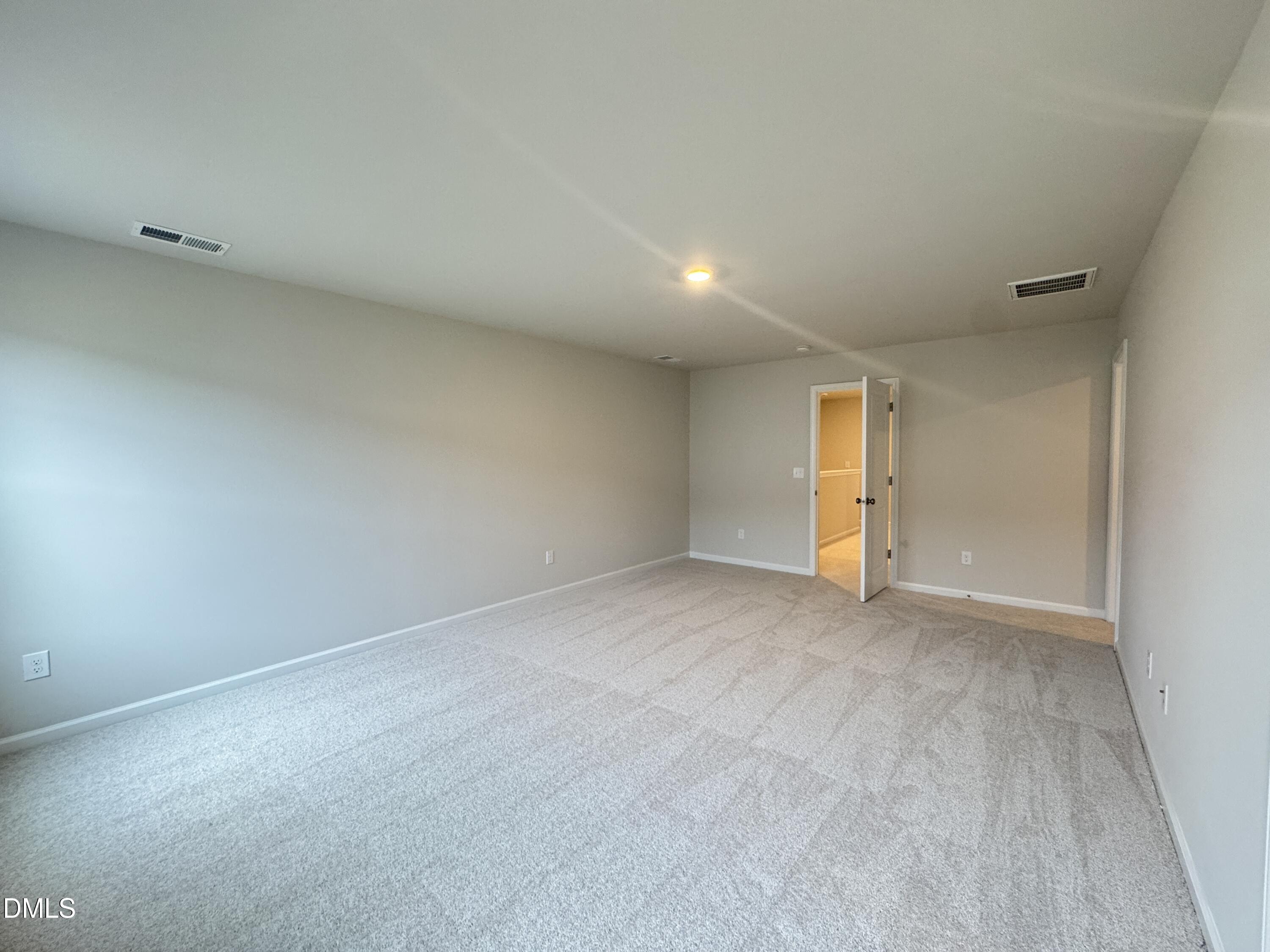523 Hester Road Durham, NC 27703 - Photo 13 of 21 a view of an empty room with a window