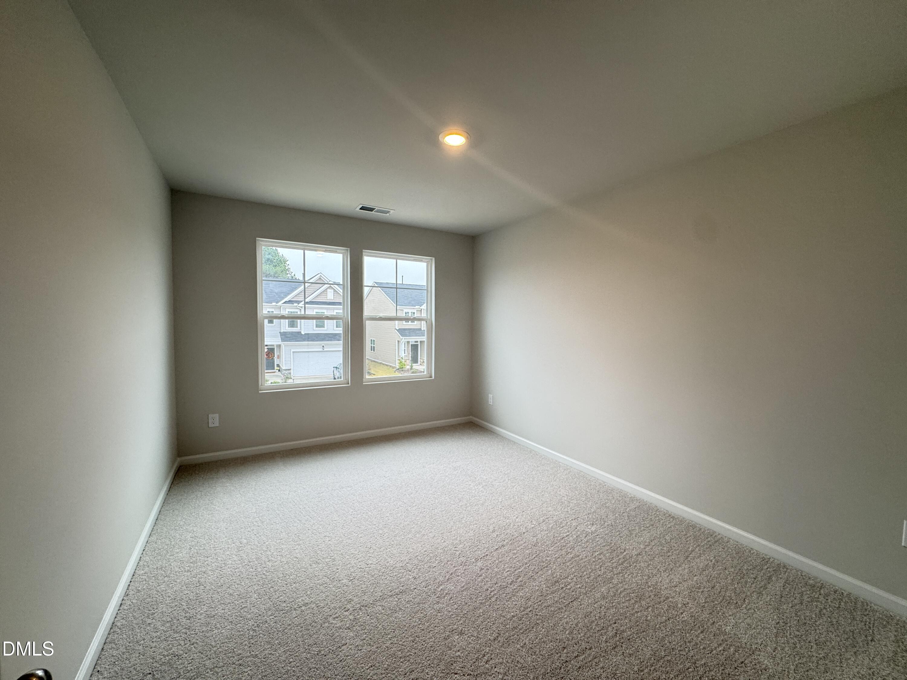 523 Hester Road Durham, NC 27703 - Photo 16 of 21 an empty room with windows