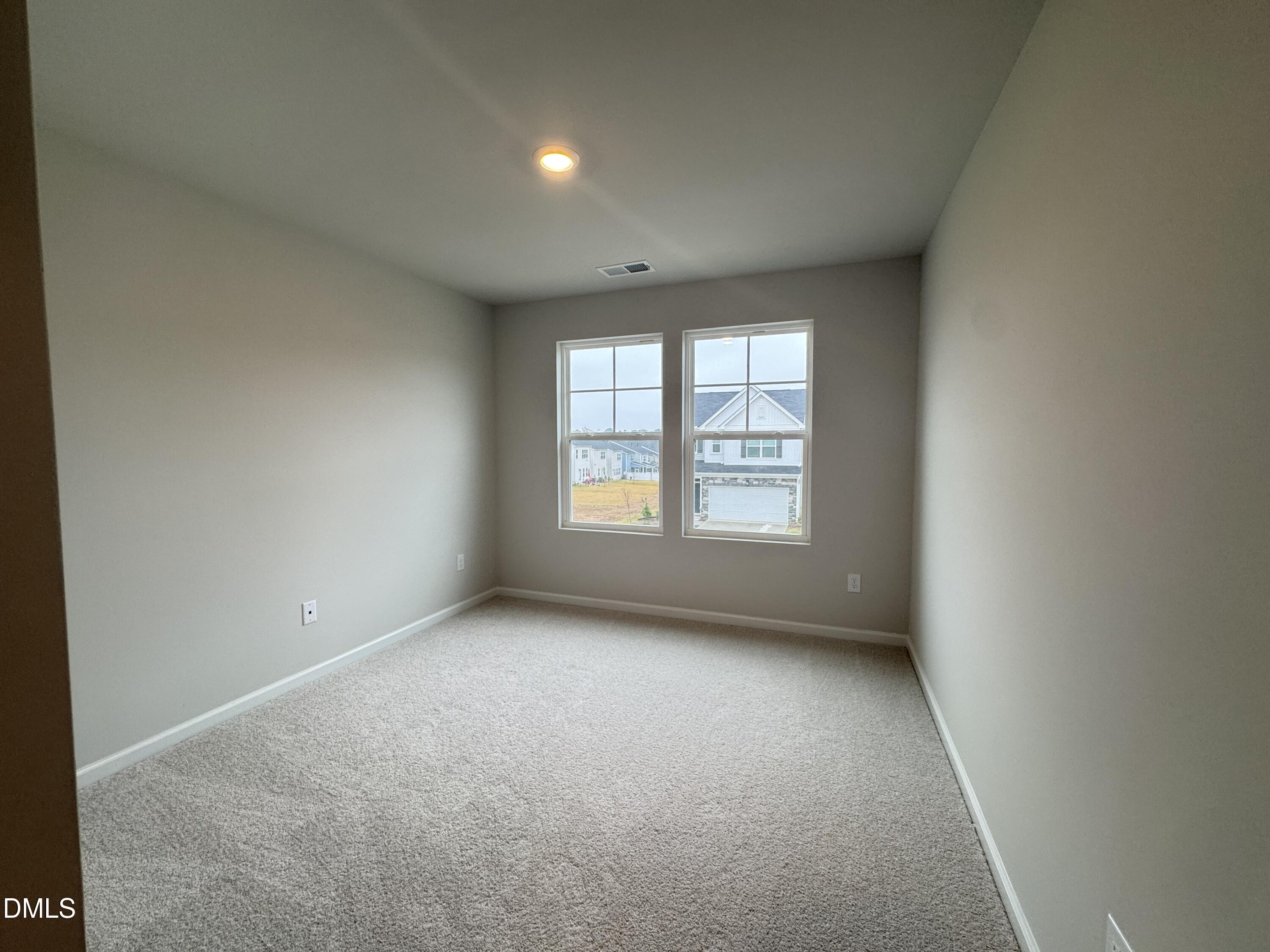 523 Hester Road Durham, NC 27703 - Photo 17 of 21 an empty room with windows