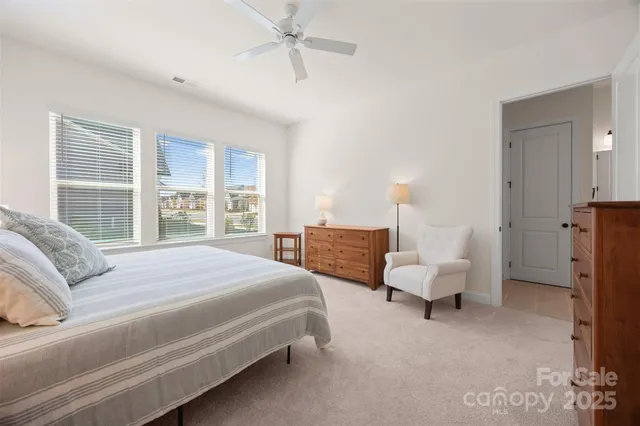 a bedroom with bed and window