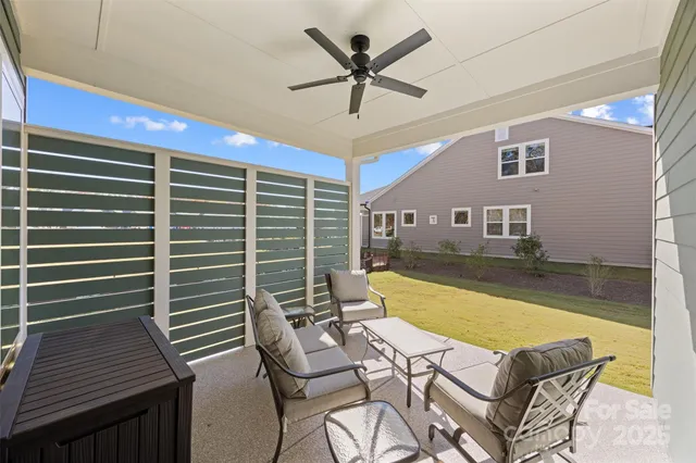 a view of a patio with a table and chairs
