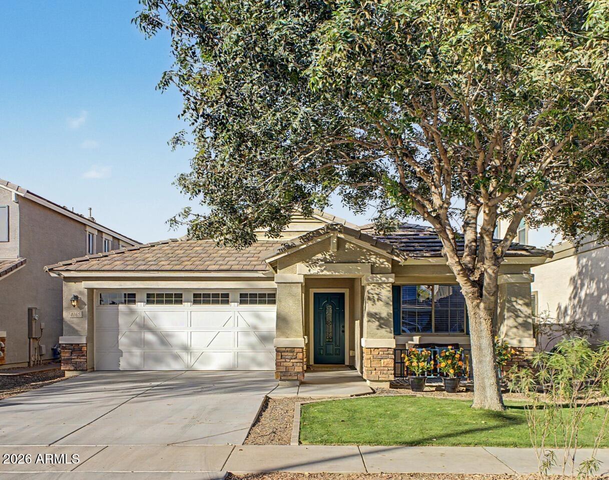 4168 East Sandy Way Gilbert, AZ 85297 - Photo 1 of 47 a front view of a house with garden