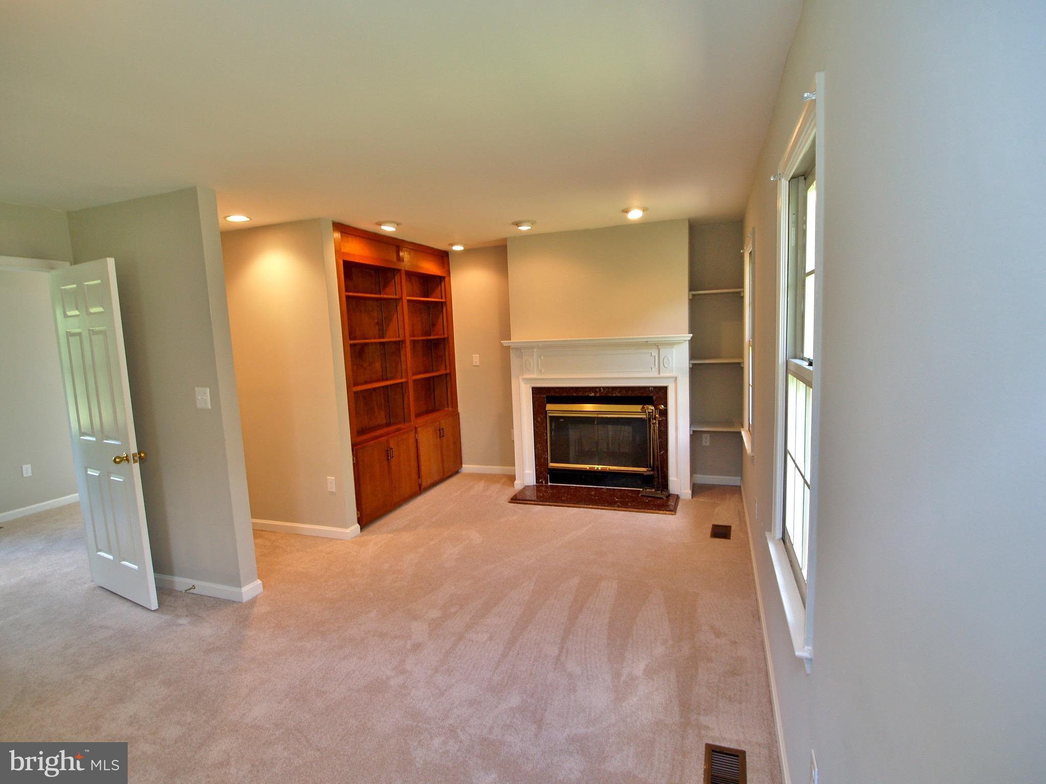 661 Bryants Nursery Road Silver Spring, MD 20905 - Photo 11 of 30 Built-in bookshelves & double-sided fireplace
