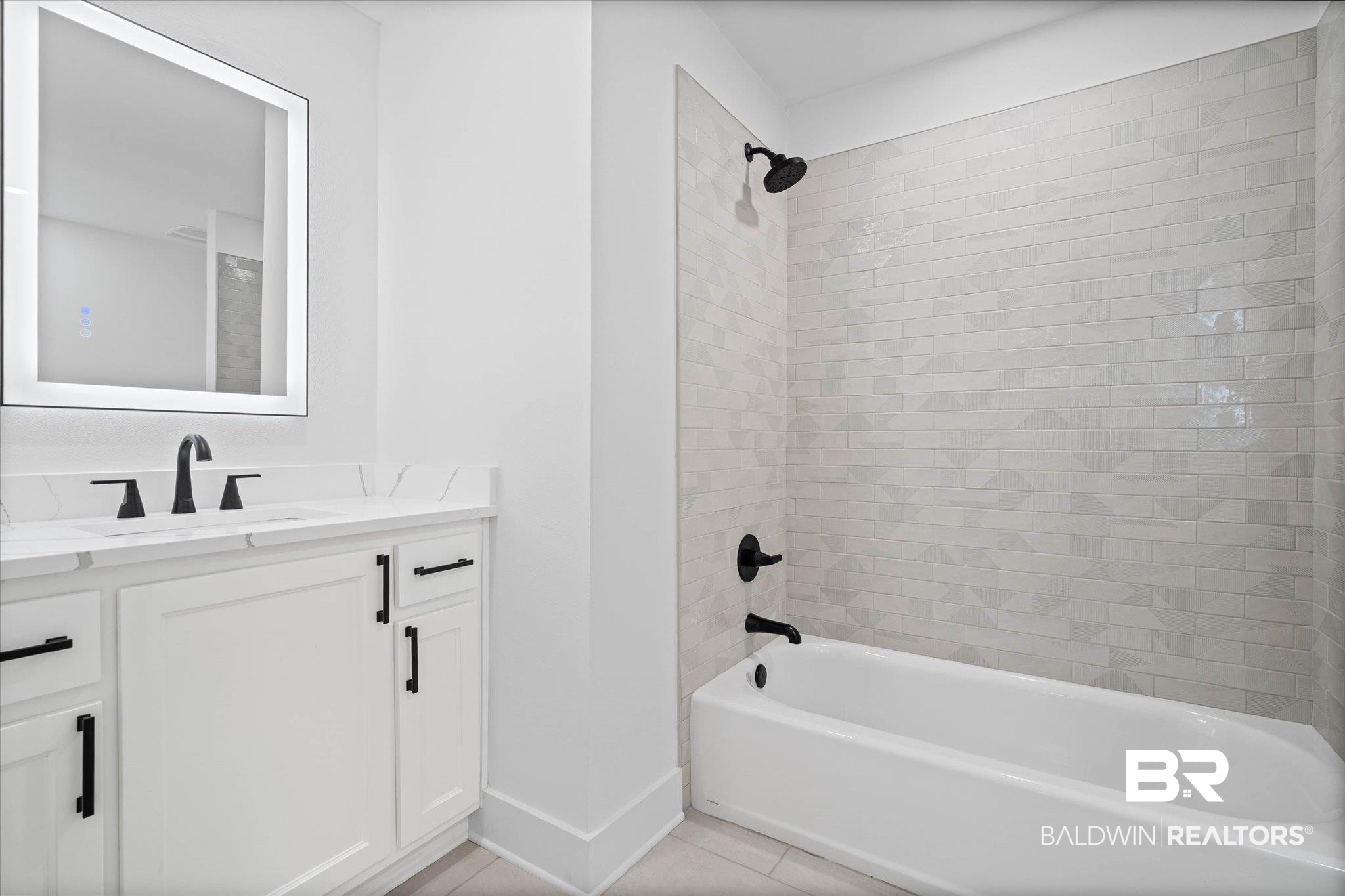 11 Schwaemmle Drive Mobile, AL 36608 - Photo 22 of 32 Full bath with vanity, bathing tub / shower combination, and light tile patterned floors