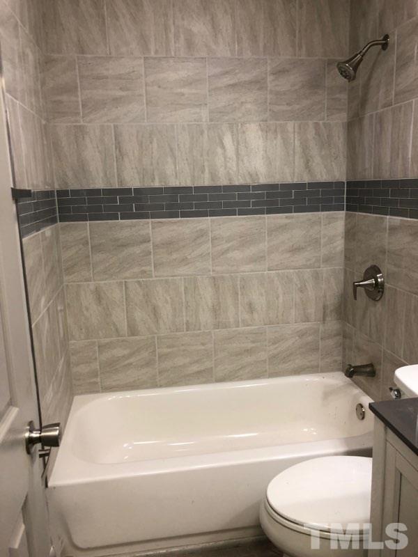 924 Seabrook Road Raleigh, NC 27610 - Photo 8 of 10 a bathroom with a bathtub and a shower
