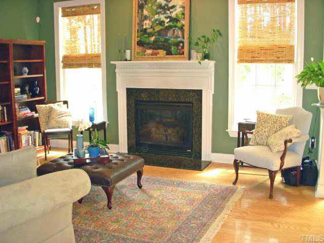 The family room has plenty of room for a cozy sofa where you can curl up in front of the fireplace, watch TV, enjoy family!