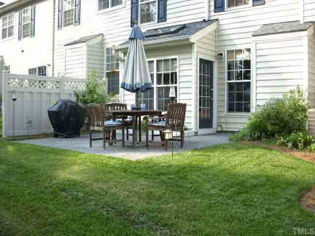 Extra large patio is upgraded with stamped concrete. Enjoy the landscaping -- someone else maintains it!