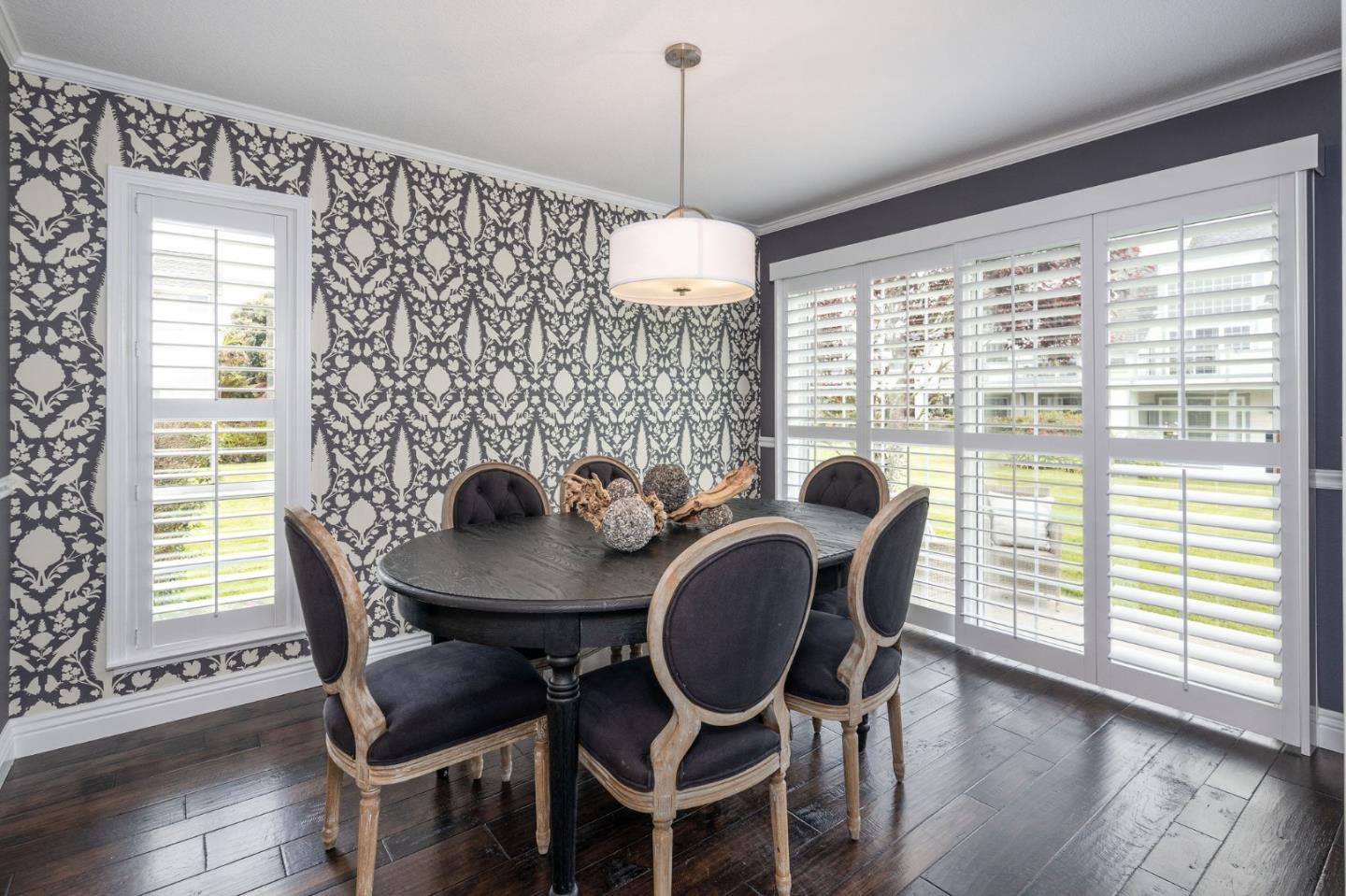 10 Merion Road Half Moon Bay, CA 94019 - Photo 11 of 39 a dining room with furniture a chandelier and wooden floor