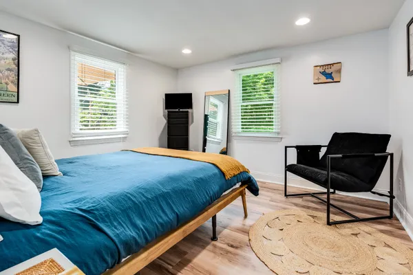 a bedroom with a bed and a window