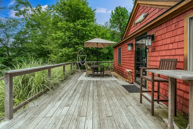 a view of balcony with furniture and wooden floor