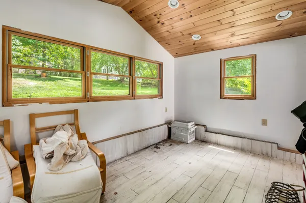 a spacious bedroom with a large bed and a window