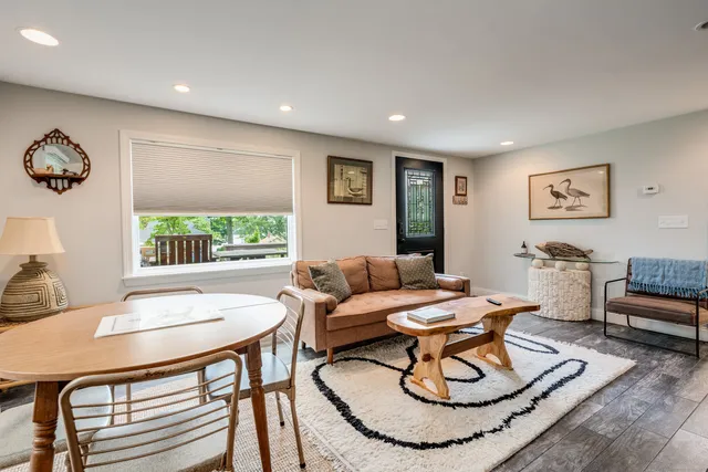 a living room with furniture and a table