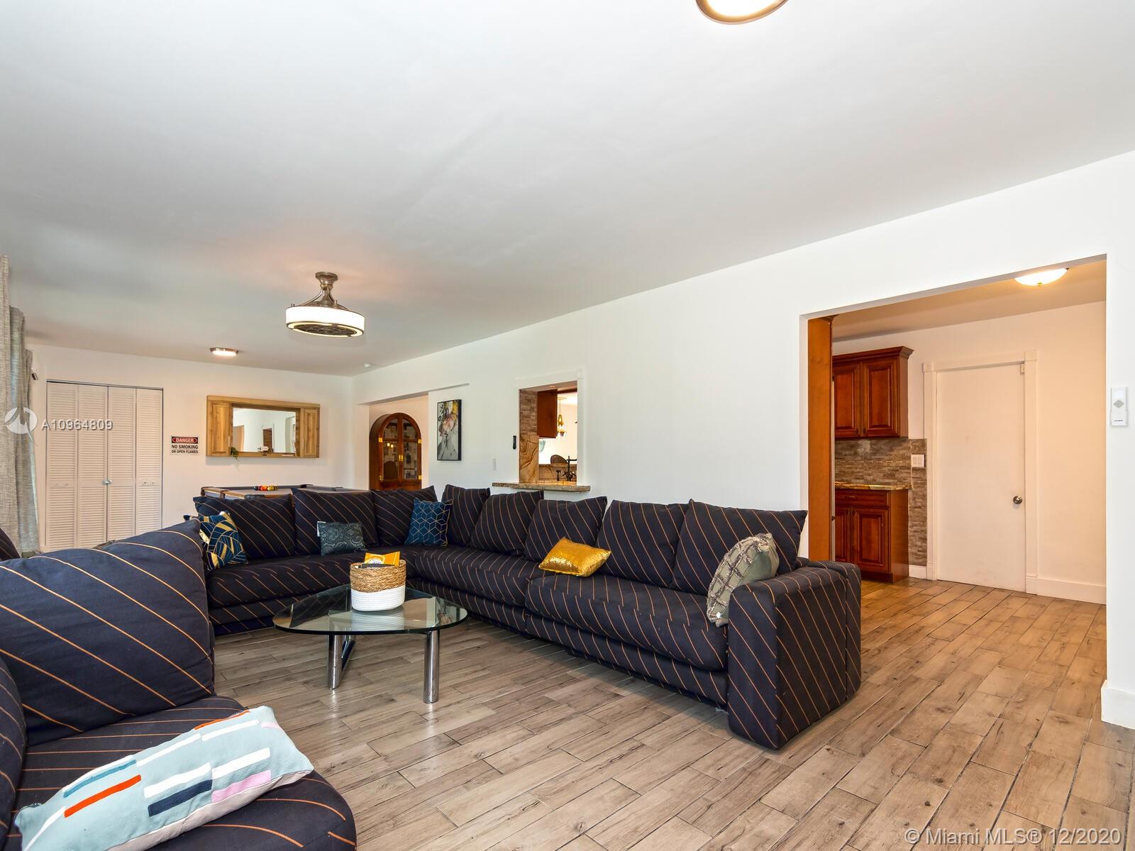 4701 West Park Road Hollywood, FL 33021 - Photo 22 of 47 a living room with furniture and a couch