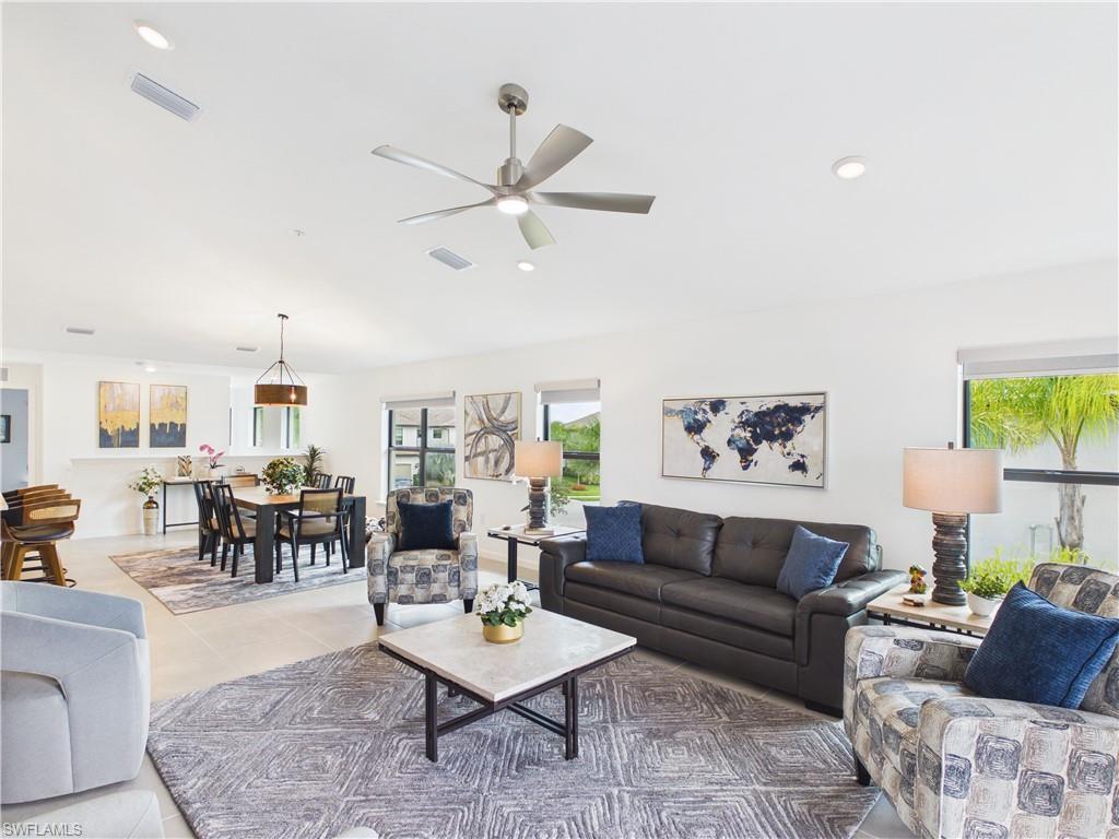 5683 Mayflower Way, Unit 908 Ave Maria, FL 34142 - Photo 8 of 37 Tiled living area featuring ceiling fan and recessed lighting
