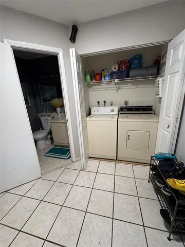 a kitchen with a sink a stove and cabinets